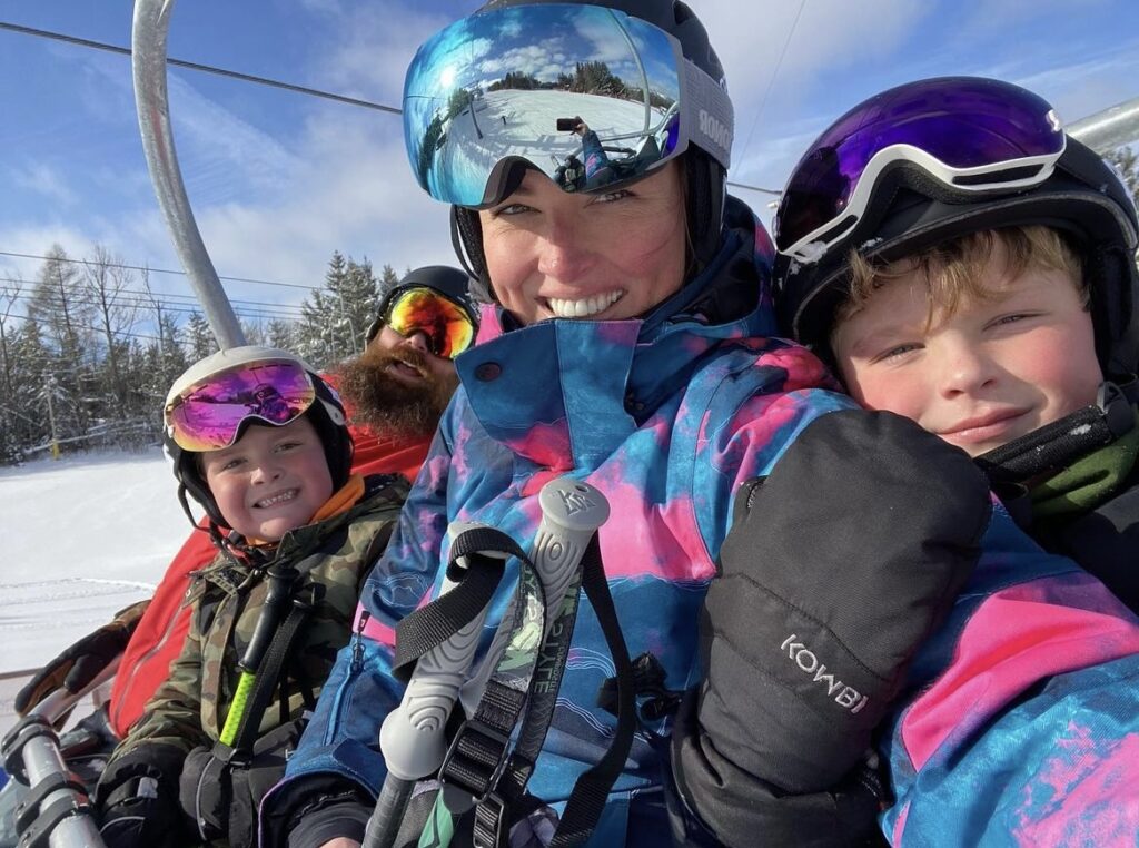 Family smiling on chairlift